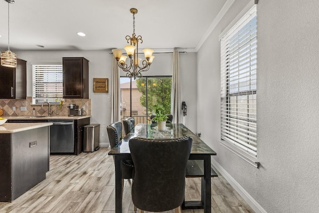 1231 Tumbleweed Trl, Temple, TX 76502 - dining room with light wood finished floors, a chandelier, and ornamental molding