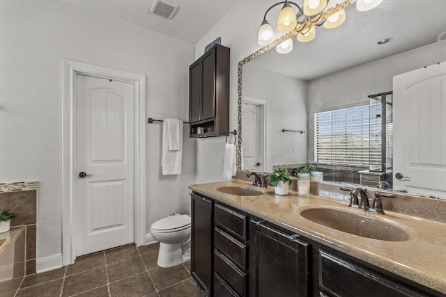 1231 Tumbleweed Trl, Temple, TX 76502 - bathroom featuring double vanity, tile patterned floors, and a bath