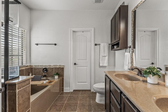 1231 Tumbleweed Trl, Temple, TX 76502 - full bathroom featuring a bath, double vanity, and tile patterned flooring