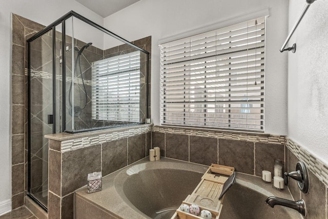 1231 Tumbleweed Trl, Temple, TX 76502 - bathroom featuring a bath, plenty of natural light, and a stall shower