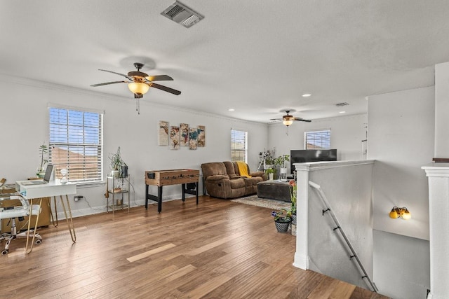 1231 Tumbleweed Trl, Temple, TX 76502 - living area featuring ceiling fan, wood finished floors, crown molding, and recessed lighting