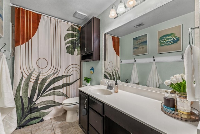1231 Tumbleweed Trl, Temple, TX 76502 - bathroom with vanity, tile patterned flooring, a shower with curtain, and a textured ceiling