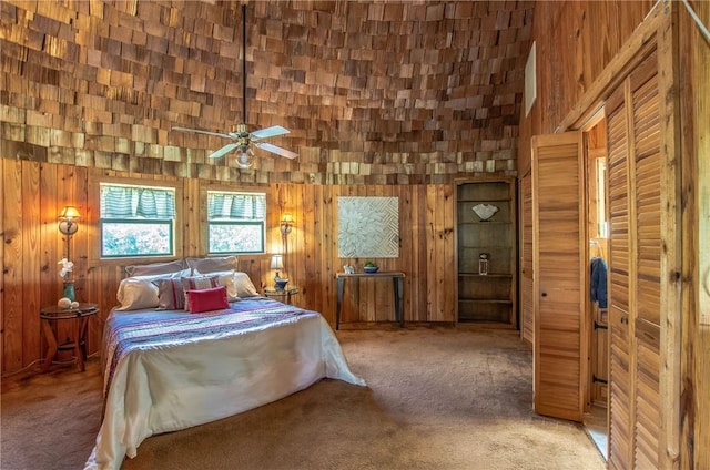 450 Oakwood Loop, San Marcos, TX 78666 - bedroom featuring carpet and wood walls