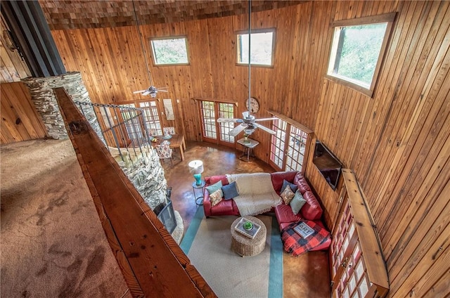 450 Oakwood Loop, San Marcos, TX 78666 - living area with wooden walls and a ceiling fan