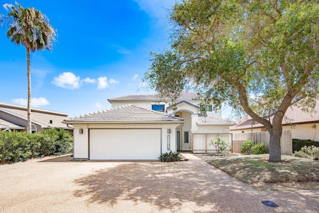 13517 Carlos Fifth Ct, Corpus Christi, TX 78418 - traditional-style home featuring an attached garage, stucco siding, driveway, and a tile roof