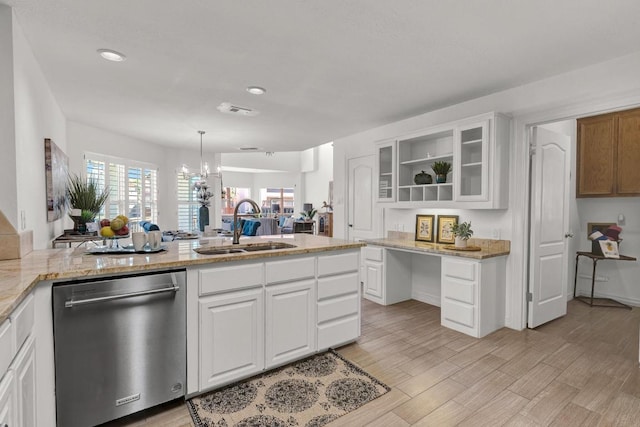 13517 Carlos Fifth Ct, Corpus Christi, TX 78418 - kitchen featuring stainless steel dishwasher, open shelves, white cabinets, light wood-type flooring, and light stone counters