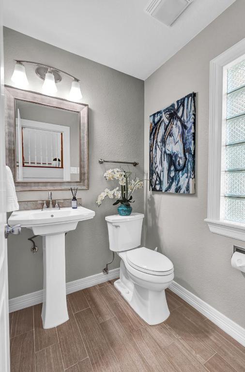 13517 Carlos Fifth Ct, Corpus Christi, TX 78418 - bathroom with wood finish floors and healthy amount of natural light