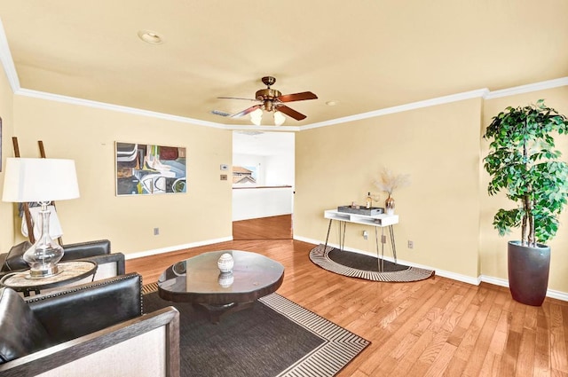 13517 Carlos Fifth Ct, Corpus Christi, TX 78418 - living room with wood finished floors, ceiling fan, and ornamental molding