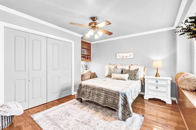 13517 Carlos Fifth Ct, Corpus Christi, TX 78418 - bedroom with a closet, ornamental molding, wood finished floors, and ceiling fan