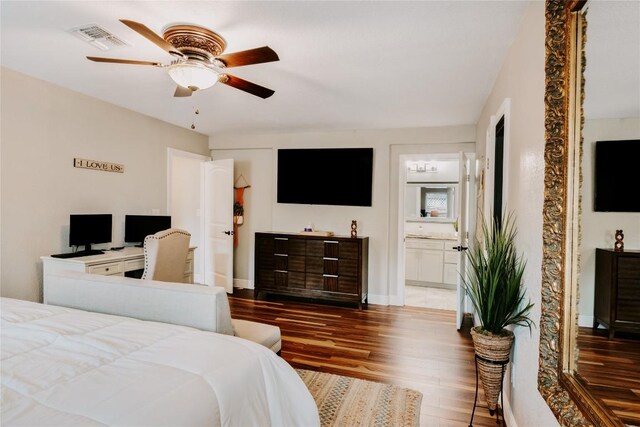 134 Sinclair St, Corpus Christi, TX 78411 - bedroom with wood finished floors, ensuite bathroom, and a ceiling fan