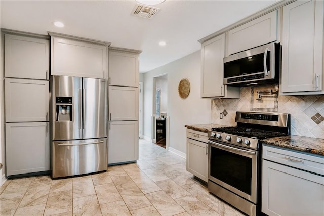 134 Sinclair St, Corpus Christi, TX 78411 - kitchen with stainless steel appliances, gray cabinetry, decorative backsplash, and recessed lighting