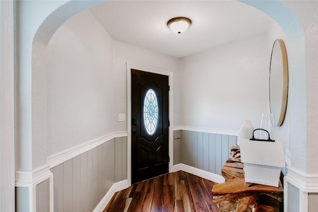 134 Sinclair St, Corpus Christi, TX 78411 - entrance foyer featuring dark wood-type flooring, wainscoting, and arched walkways