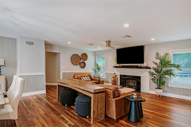 134 Sinclair St, Corpus Christi, TX 78411 - living room featuring wood finished floors, a high end fireplace, a ceiling fan, and recessed lighting