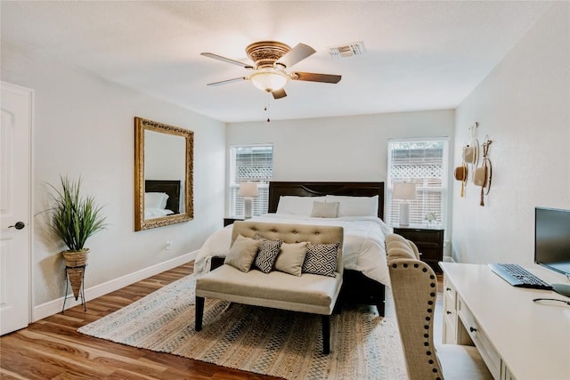 134 Sinclair St, Corpus Christi, TX 78411 - bedroom featuring multiple windows, wood finished floors, and a ceiling fan