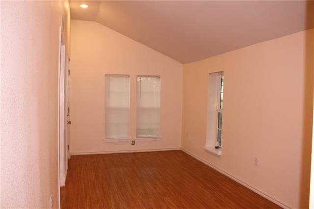 502 Toliver St, Bastrop, TX 78602 - unfurnished room featuring wood finished floors, lofted ceiling, and recessed lighting
