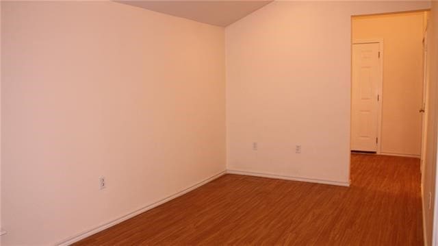 502 Toliver St, Bastrop, TX 78602 - unfurnished room featuring wood finished floors and baseboards