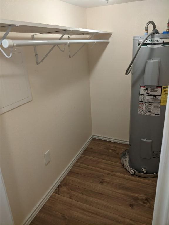 502 Toliver St, Bastrop, TX 78602 - spacious closet with water heater and dark wood-style floors