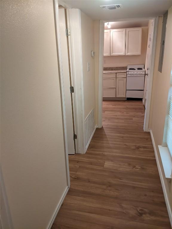 502 Toliver St, Bastrop, TX 78602 - hallway with wood finished floors and baseboards