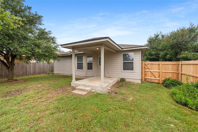 237 Baldwin St, Hutto, TX 78634 - rear view of property with a fenced backyard and a patio