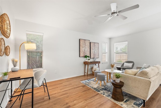237 Baldwin St, Hutto, TX 78634 - living area with wood finished floors and ceiling fan