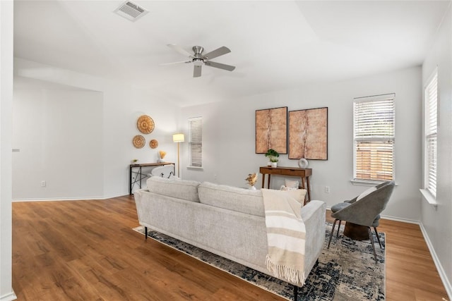 237 Baldwin St, Hutto, TX 78634 - living room featuring a ceiling fan, wood finished floors, and plenty of natural light