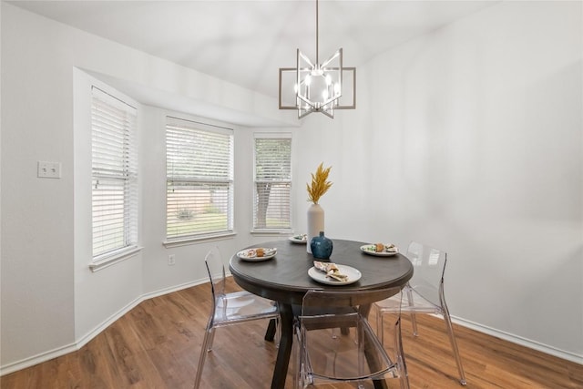 237 Baldwin St, Hutto, TX 78634 - dining area featuring wood finished floors and a chandelier