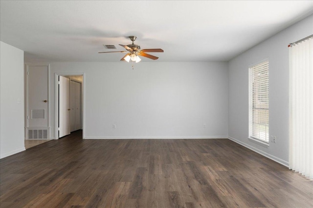 114 Pecan Dr, Elgin, TX 78621 - unfurnished room with dark wood-style floors and ceiling fan