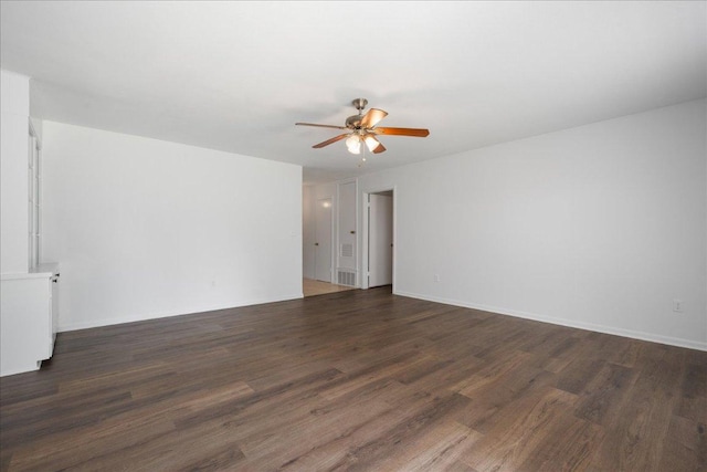 114 Pecan Dr, Elgin, TX 78621 - empty room with a ceiling fan and dark wood-style floors