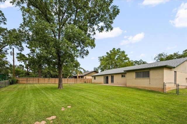 114 Pecan Dr, Elgin, TX 78621 - fenced backyard with a gate