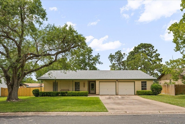 114 Pecan Dr, Elgin, TX 78621 - ranch-style house featuring a garage and driveway