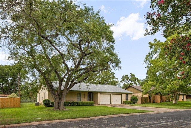 114 Pecan Dr, Elgin, TX 78621 - view of front of property featuring a garage and concrete driveway