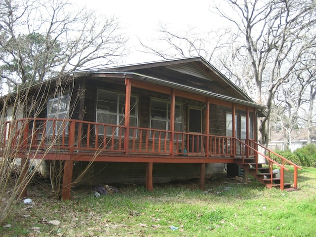 169 Pine Song, Bastrop, TX 78602 - back of property featuring a porch