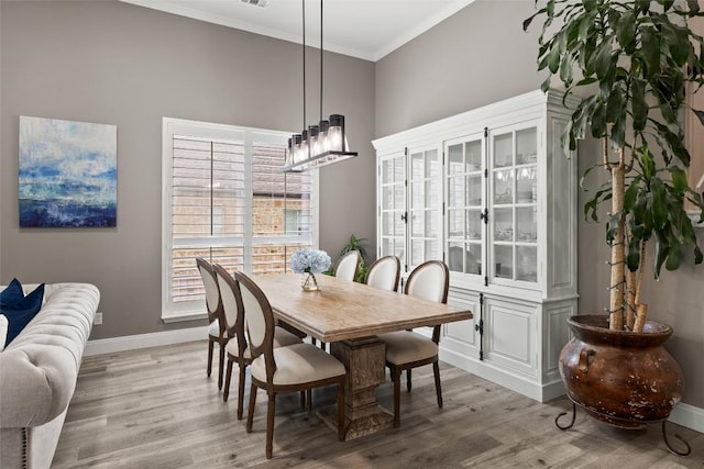 291 Torrington Dr, Austin, TX 78737 - dining space featuring crown molding, light wood finished floors, and healthy amount of natural light