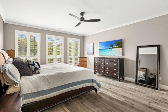 291 Torrington Dr, Austin, TX 78737 - bedroom featuring crown molding, wood finished floors, and a ceiling fan