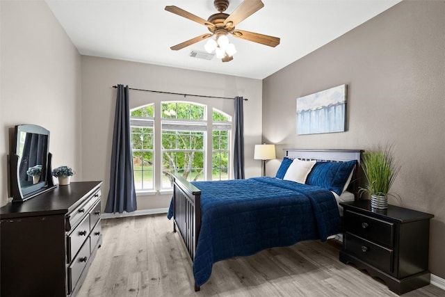 291 Torrington Dr, Austin, TX 78737 - bedroom featuring light wood-style flooring and a ceiling fan
