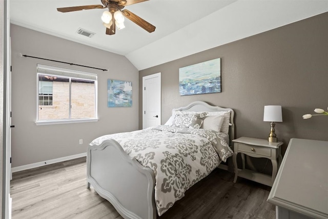 291 Torrington Dr, Austin, TX 78737 - bedroom featuring wood finished floors, vaulted ceiling, and ceiling fan