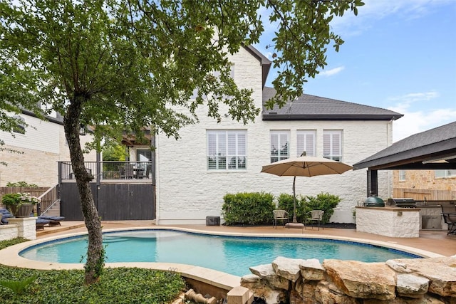 291 Torrington Dr, Austin, TX 78737 - view of swimming pool with an outdoor kitchen, stairway, and a patio