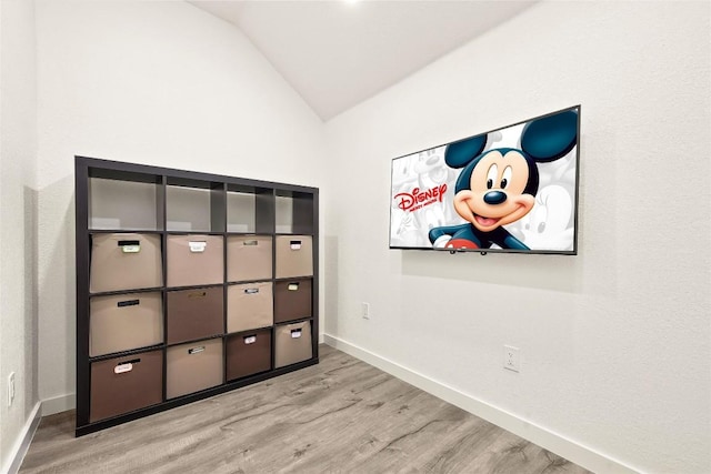 291 Torrington Dr, Austin, TX 78737 - unfurnished bedroom featuring lofted ceiling and wood finished floors