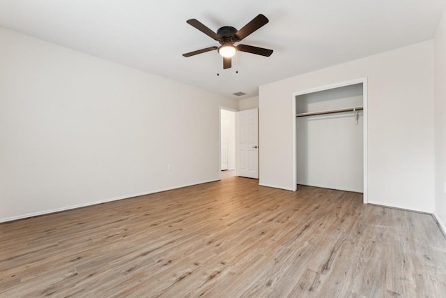 9004 Postvine Dr, Austin, TX 78724 - unfurnished bedroom with wood finished floors, a closet, and a ceiling fan
