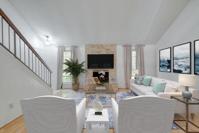 7400 Ophelia Dr, Austin, TX 78752 - living area with stairway, wood finished floors, lofted ceiling, and a brick fireplace