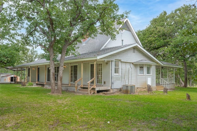 2981 Vivroux Ranch Rd, Seguin, TX 78155 - back of house featuring covered porch, a yard, and roof with shingles