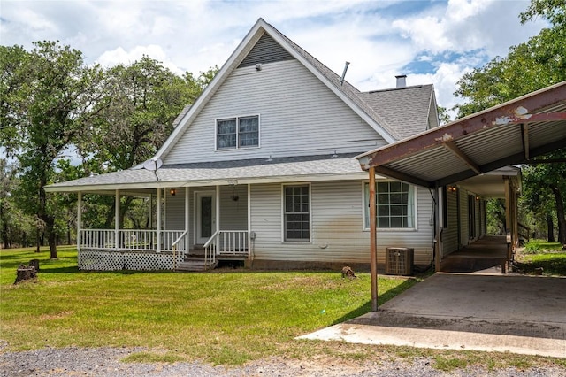 2981 Vivroux Ranch Rd, Seguin, TX 78155 - view of front of property featuring a porch, a front lawn, roof with shingles, and an attached carport