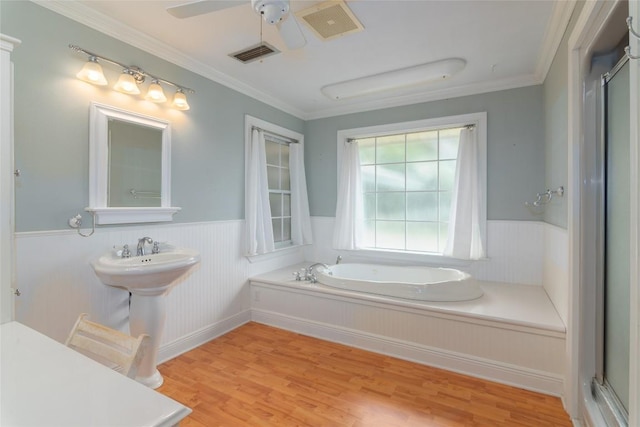 2981 Vivroux Ranch Rd, Seguin, TX 78155 - bathroom with a wainscoted wall, a bath, wood finished floors, a shower stall, and crown molding