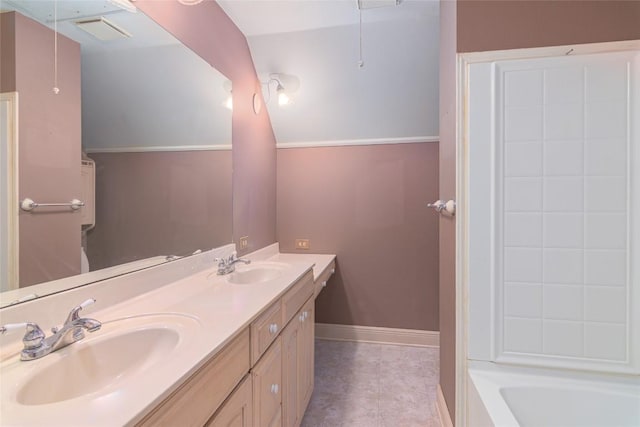 2981 Vivroux Ranch Rd, Seguin, TX 78155 - full bath featuring double vanity, tile patterned flooring, washtub / shower combination, and lofted ceiling