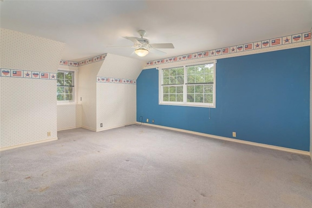 2981 Vivroux Ranch Rd, Seguin, TX 78155 - spare room with a ceiling fan, carpet flooring, wallpapered walls, and lofted ceiling