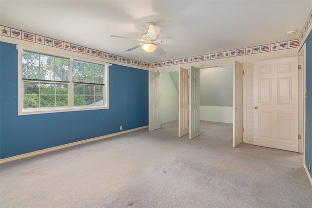 2981 Vivroux Ranch Rd, Seguin, TX 78155 - unfurnished bedroom with carpet flooring, a ceiling fan, and two closets