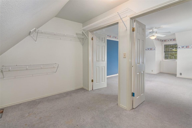 2981 Vivroux Ranch Rd, Seguin, TX 78155 - walk in closet with carpet floors, a ceiling fan, and lofted ceiling
