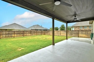 17320 Calipatria Ln, Pflugerville, TX 78660 - fenced backyard featuring ceiling fan and a patio