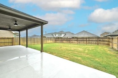 17320 Calipatria Ln, Pflugerville, TX 78660 - fenced backyard with a patio area and a ceiling fan