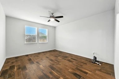 17320 Calipatria Ln, Pflugerville, TX 78660 - spare room with wood finished floors and a ceiling fan